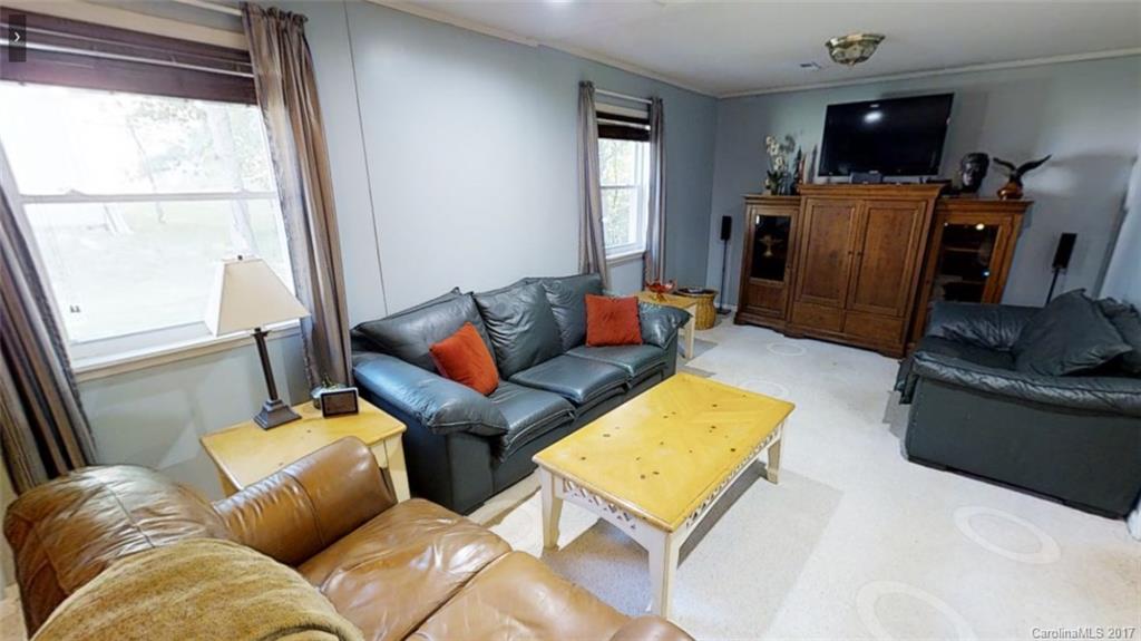 1606 Windsong Forest Road Clover, SC 29710 - Photo 12 of 15 a living room with furniture and a flat screen tv