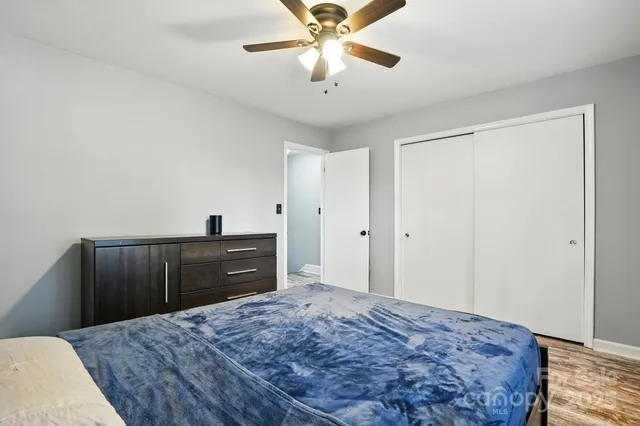 a bedroom with a bed and a dresser