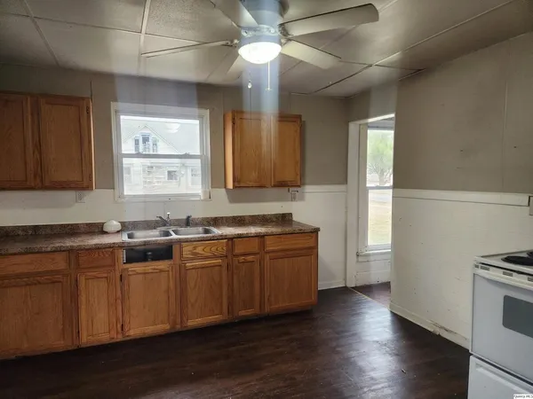 a kitchen with lots of counter space and a window
