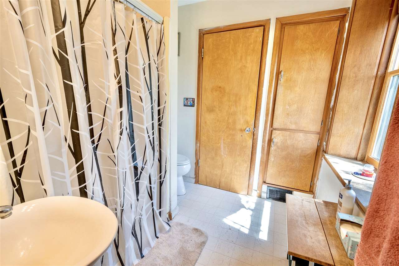 4295 Shattuck Road Garden Prairie, IL 61038 - Photo 14 of 20 a view of walk in closet with rug and wooden floor