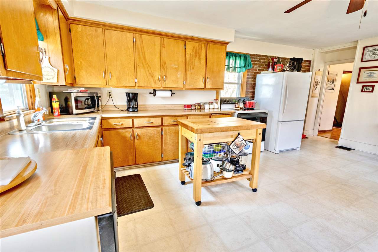 4295 Shattuck Road Garden Prairie, IL 61038 - Photo 3 of 20 a view of a kitchen with furniture and a kitchen
