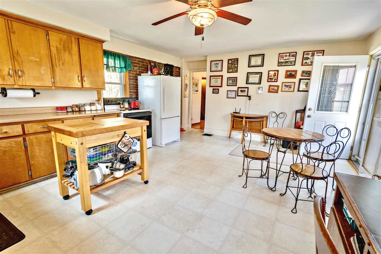4295 Shattuck Road Garden Prairie, IL 61038 - Photo 5 of 20 a kitchen with stainless steel appliances granite countertop a stove a refrigerator and a dining table