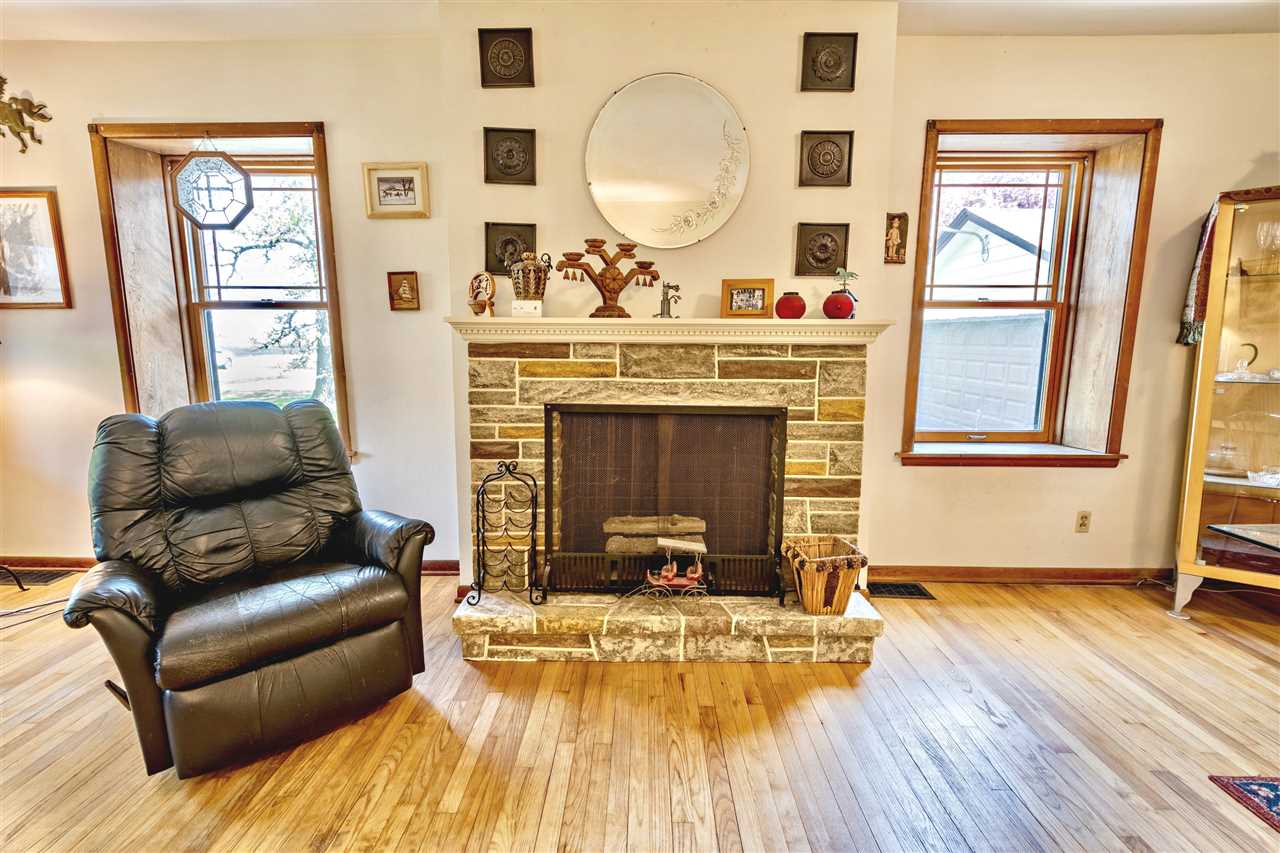 4295 Shattuck Road Garden Prairie, IL 61038 - Photo 8 of 20 a living room with furniture and a fireplace
