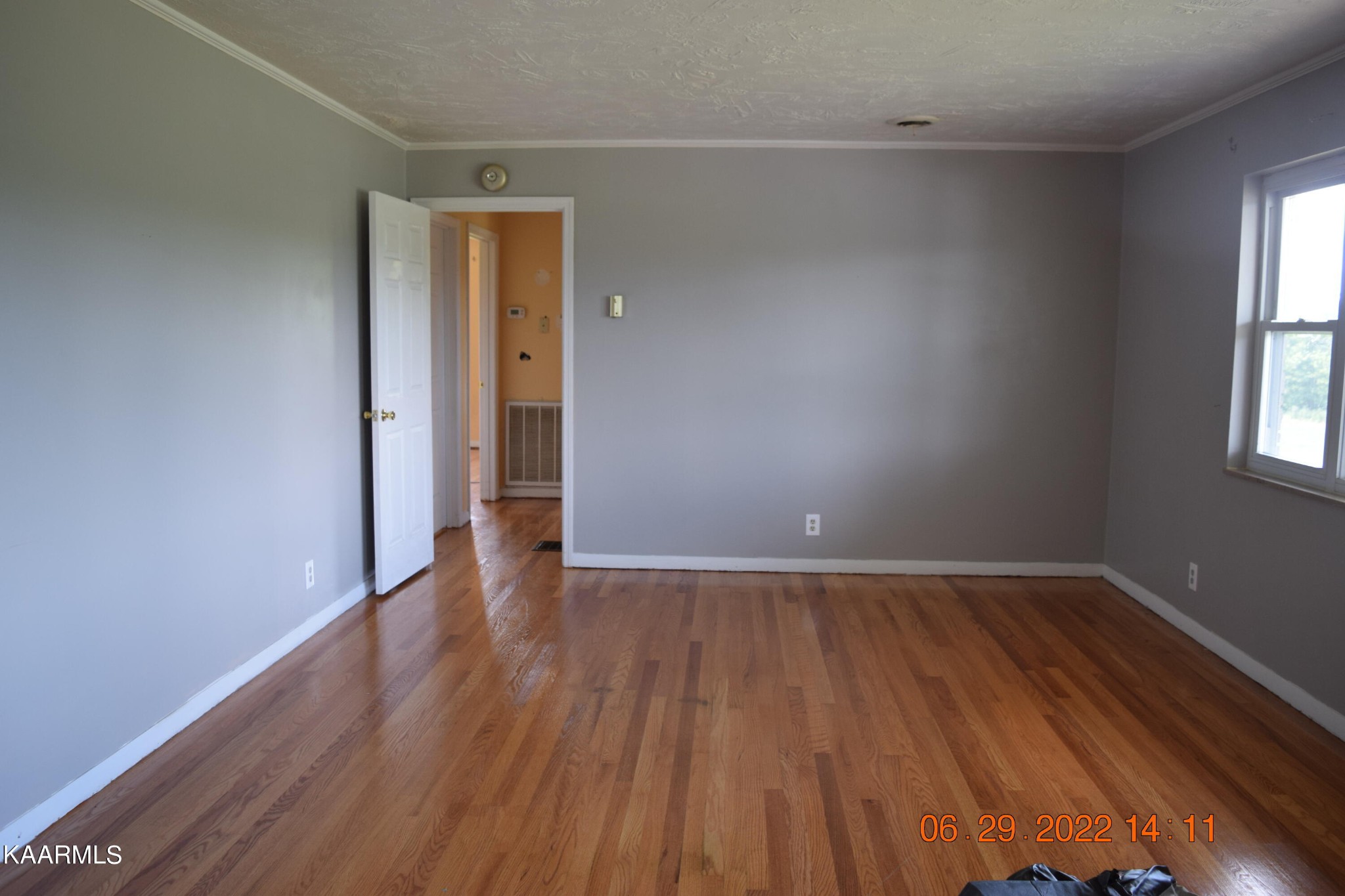 2333 Stapleton Road New Market, TN 37820 - Photo 8 of 27 an empty room with wooden floor and windows