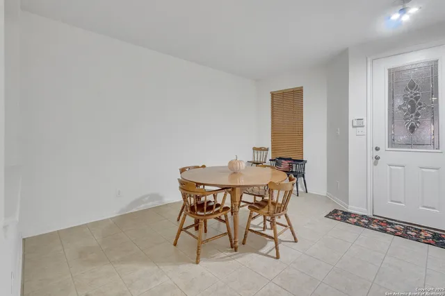 a view of a room with furniture and wooden floor