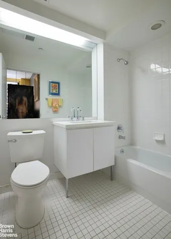 a bathroom with a sink a toilet and a bathtub