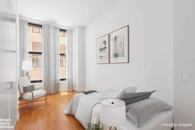 a bedroom with a bed and a couch