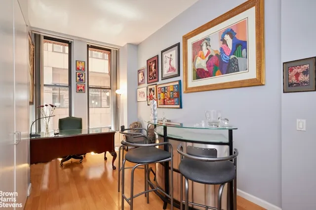 a view of a dining room with furniture and window
