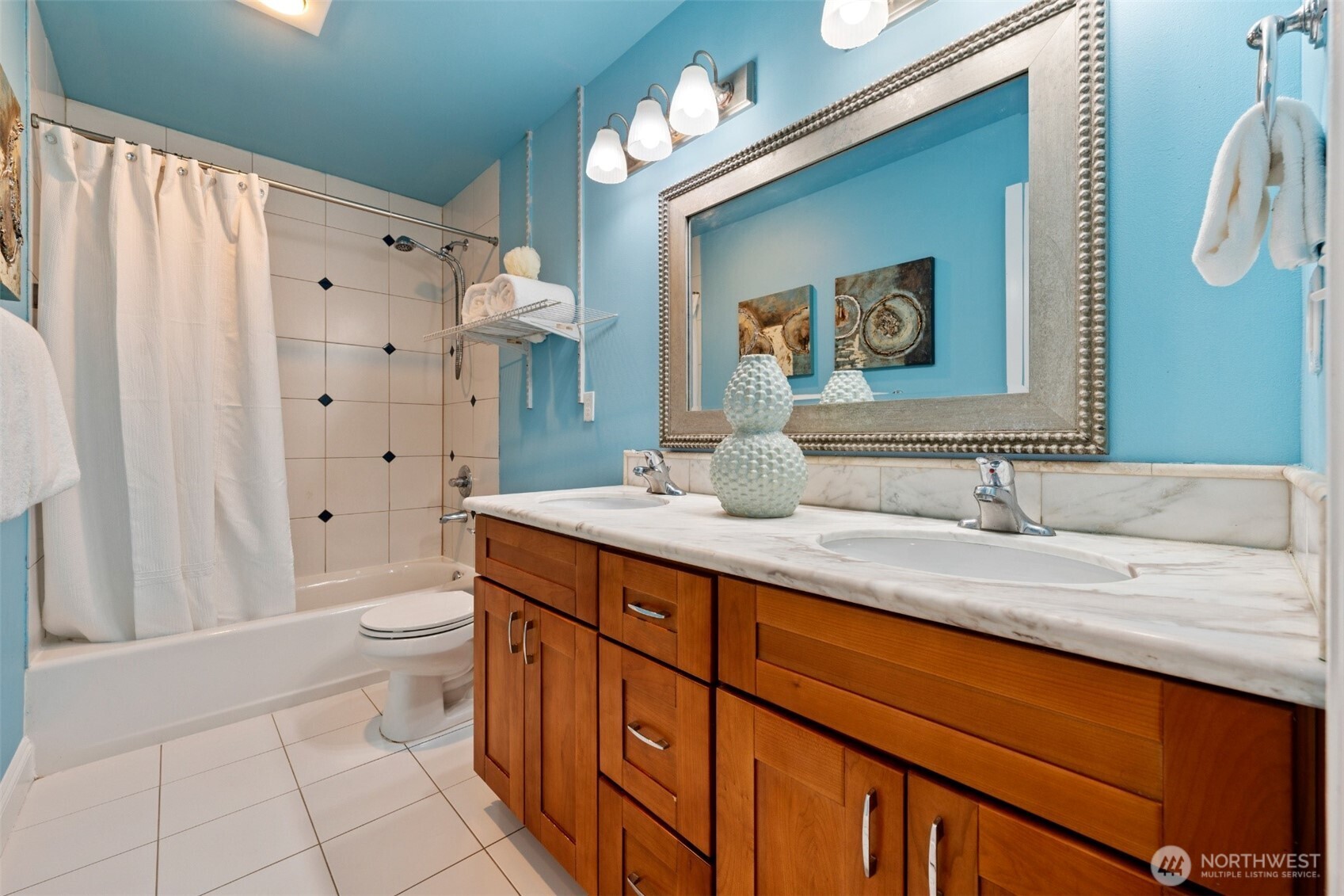7331 151st Avenue Northeast, Unit B Redmond, WA 98052 - Photo 13 of 20 a bathroom with a granite countertop sink a toilet and a large mirror