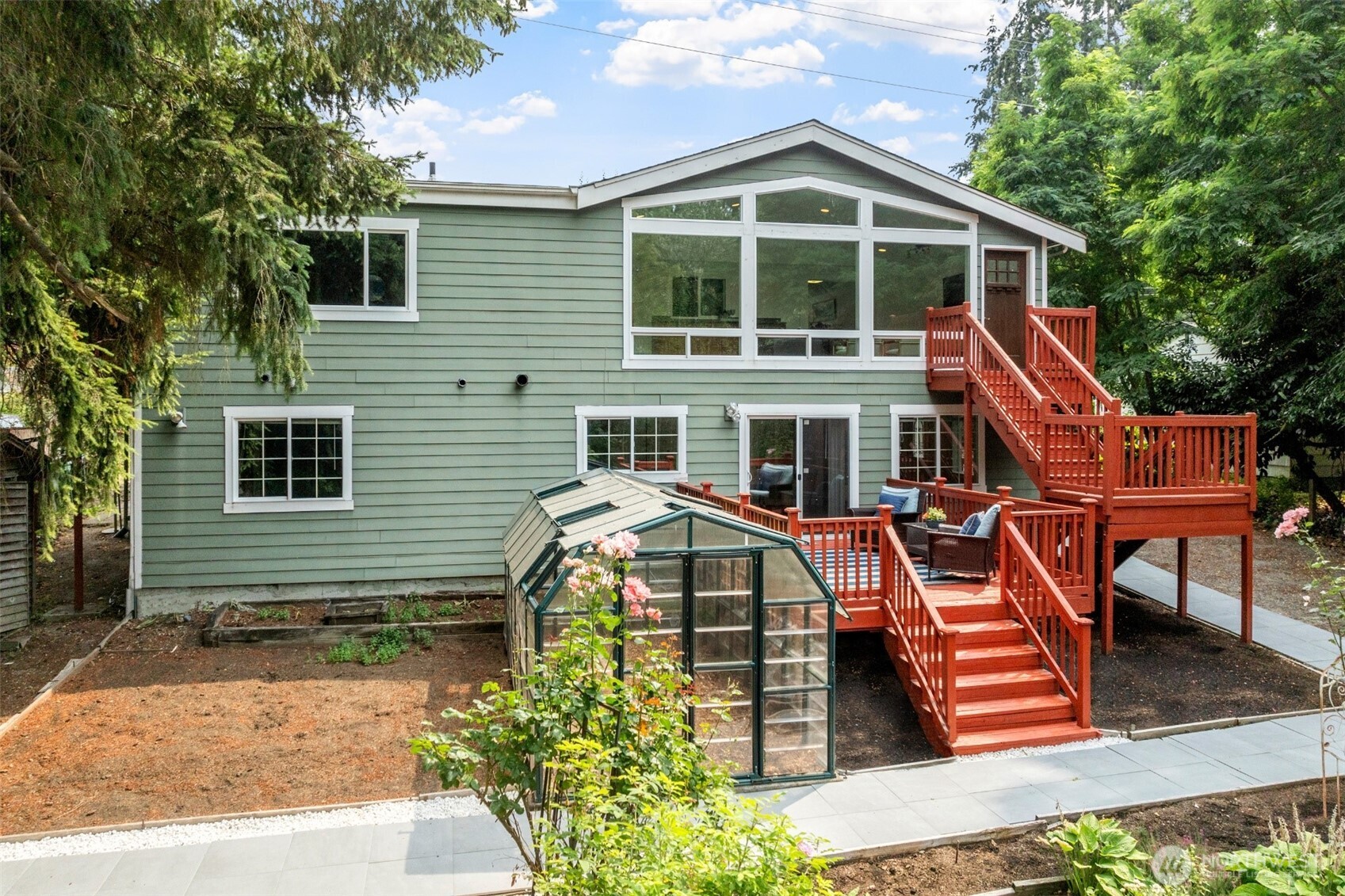 7331 151st Avenue Northeast, Unit B Redmond, WA 98052 - Photo 14 of 20 a front view of a house with a yard