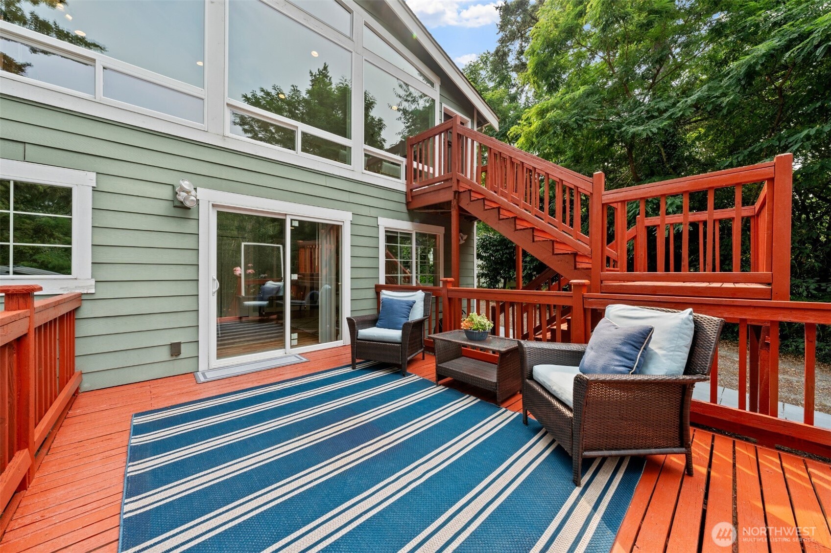7331 151st Avenue Northeast, Unit B Redmond, WA 98052 - Photo 15 of 20 a roof deck with a couch and wooden floor