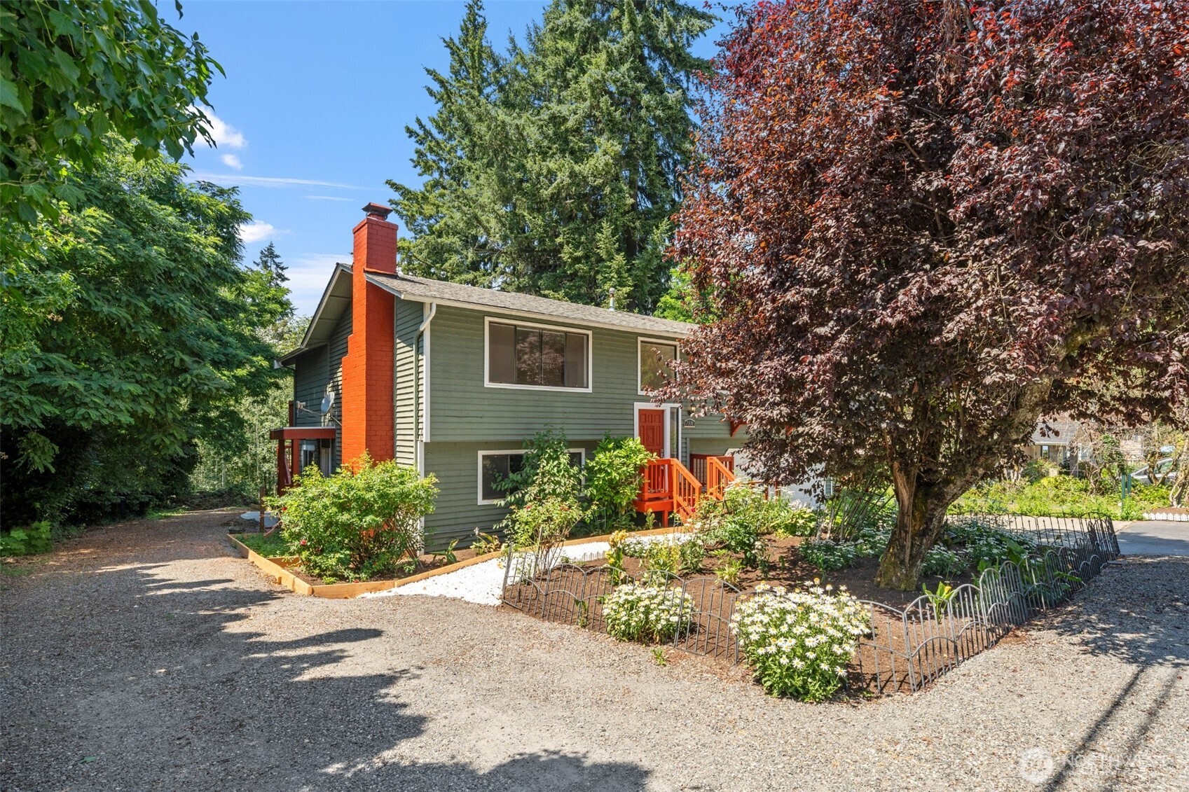 7331 151st Avenue Northeast, Unit B Redmond, WA 98052 - Photo 2 of 20 a front view of a house with a yard