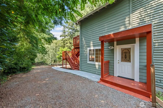 a view of a house with porch and furniture