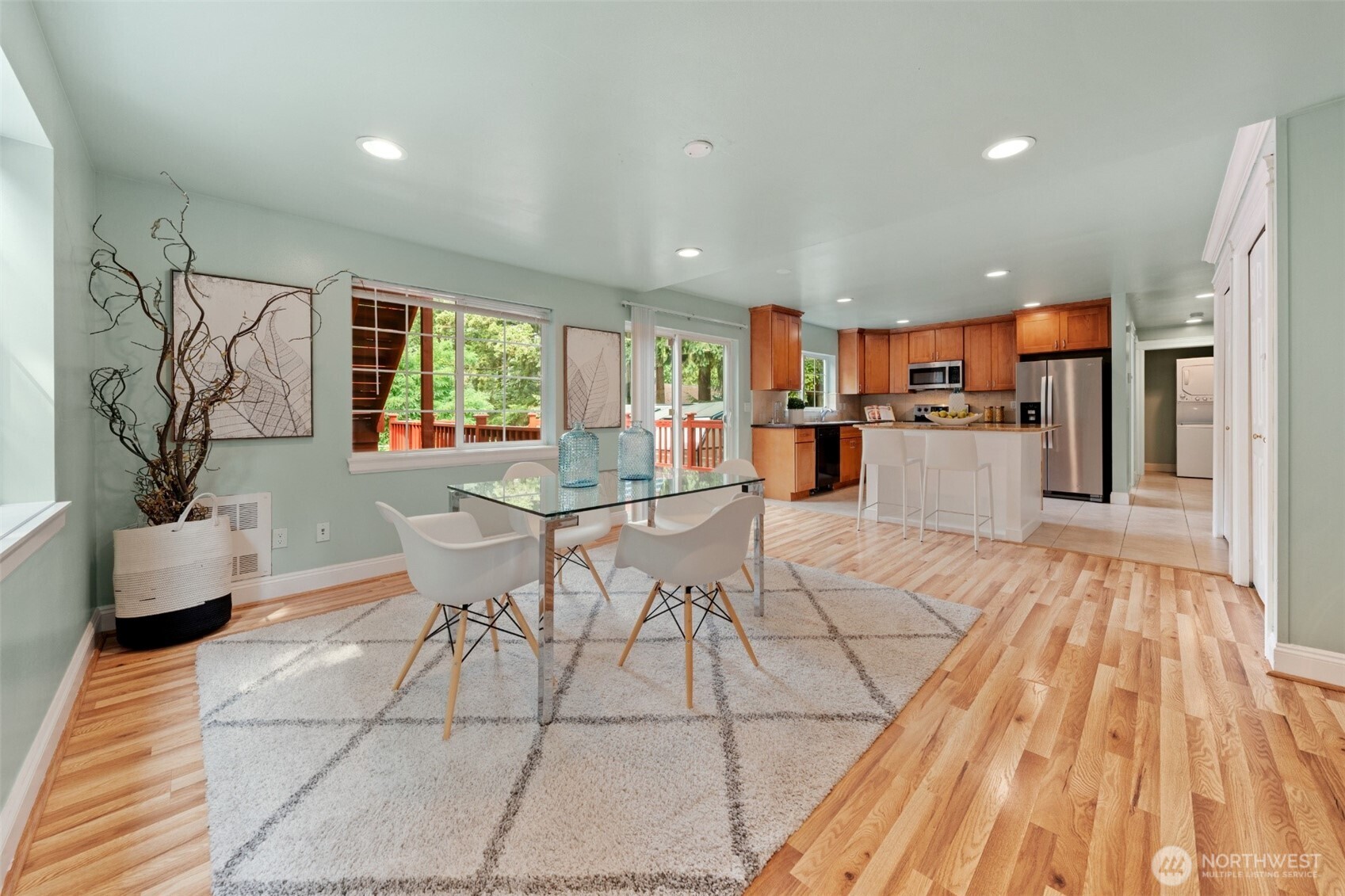 7331 151st Avenue Northeast, Unit B Redmond, WA 98052 - Photo 4 of 20 a view of a dining room with furniture window and wooden floor