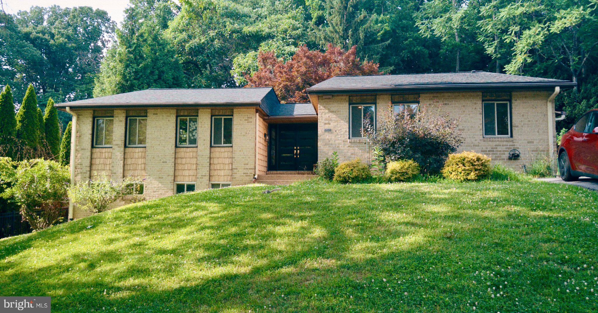 2208 Oxeye Road Baltimore, MD 21209 - Photo 1 of 1 Charming hillside home with lush greenery.