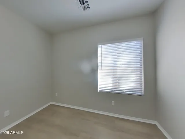 a white bath tub sitting in a bathroom next to a window