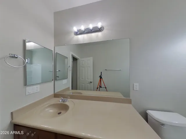 a bathroom with a toilet a sink and bathtub
