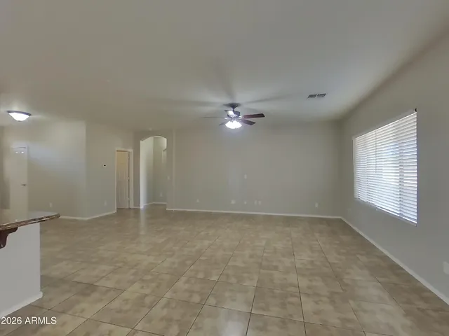a view of a kitchen with stainless steel appliances granite countertop a refrigerator and a sink