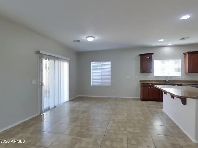 a view of a big room with windows and cabinet