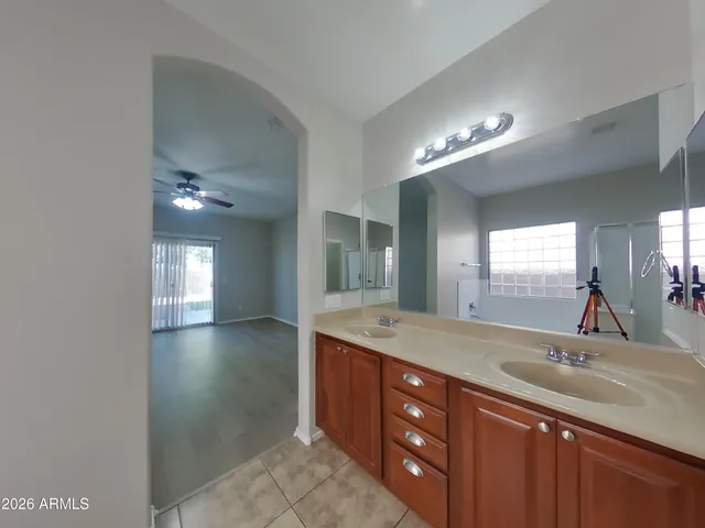 a view of empty room with wooden floor and fireplace