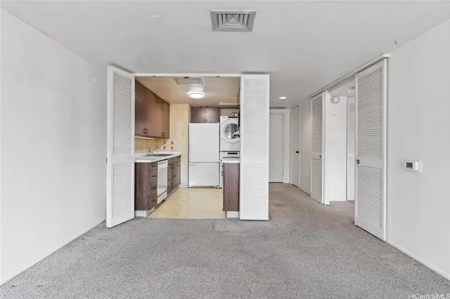 a kitchen with stainless steel appliances granite countertop a stove and a sink