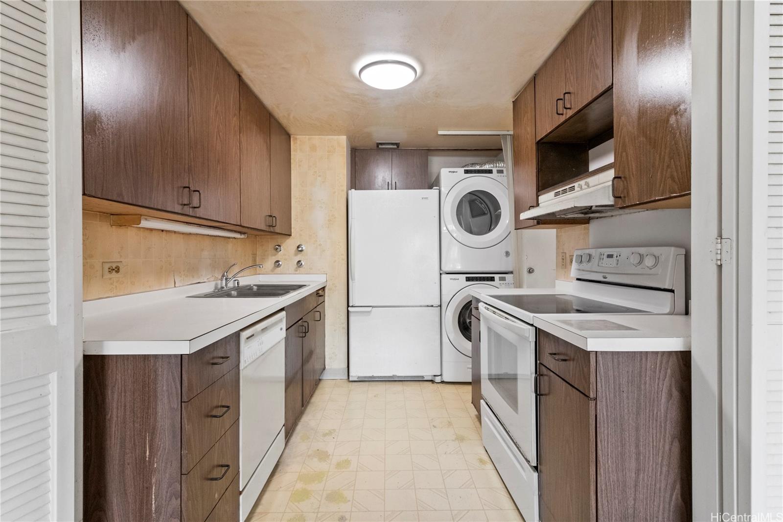 700 Richards Street, Unit 807 Honolulu, HI 96813 - Photo 6 of 15 a kitchen with stainless steel appliances granite countertop a stove and a sink