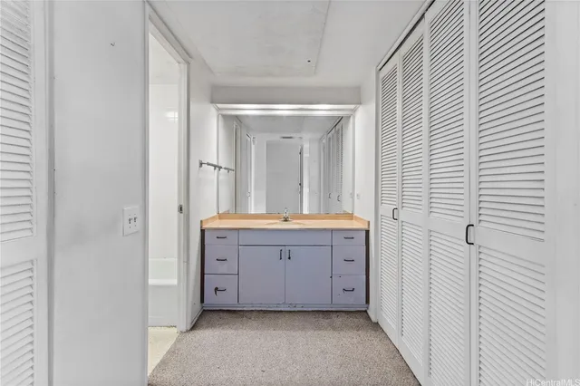a white toilet sitting next to a bath tub