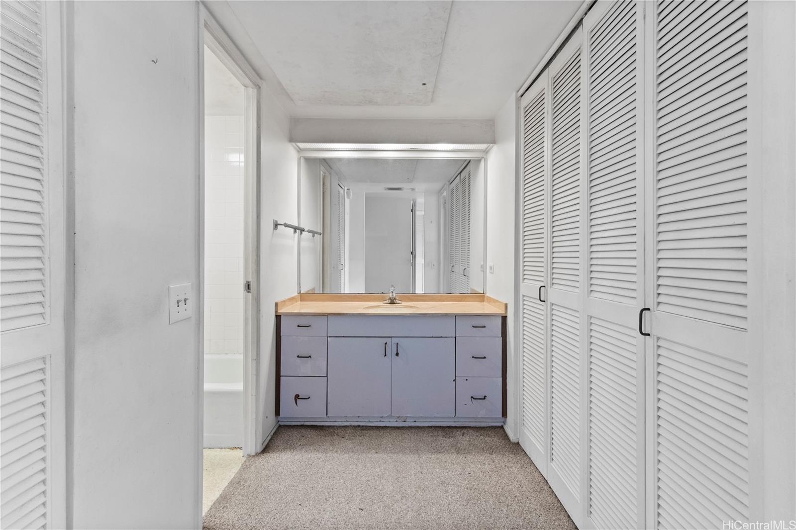 700 Richards Street, Unit 807 Honolulu, HI 96813 - Photo 8 of 15 a bathroom with a double vanity sink mirror and