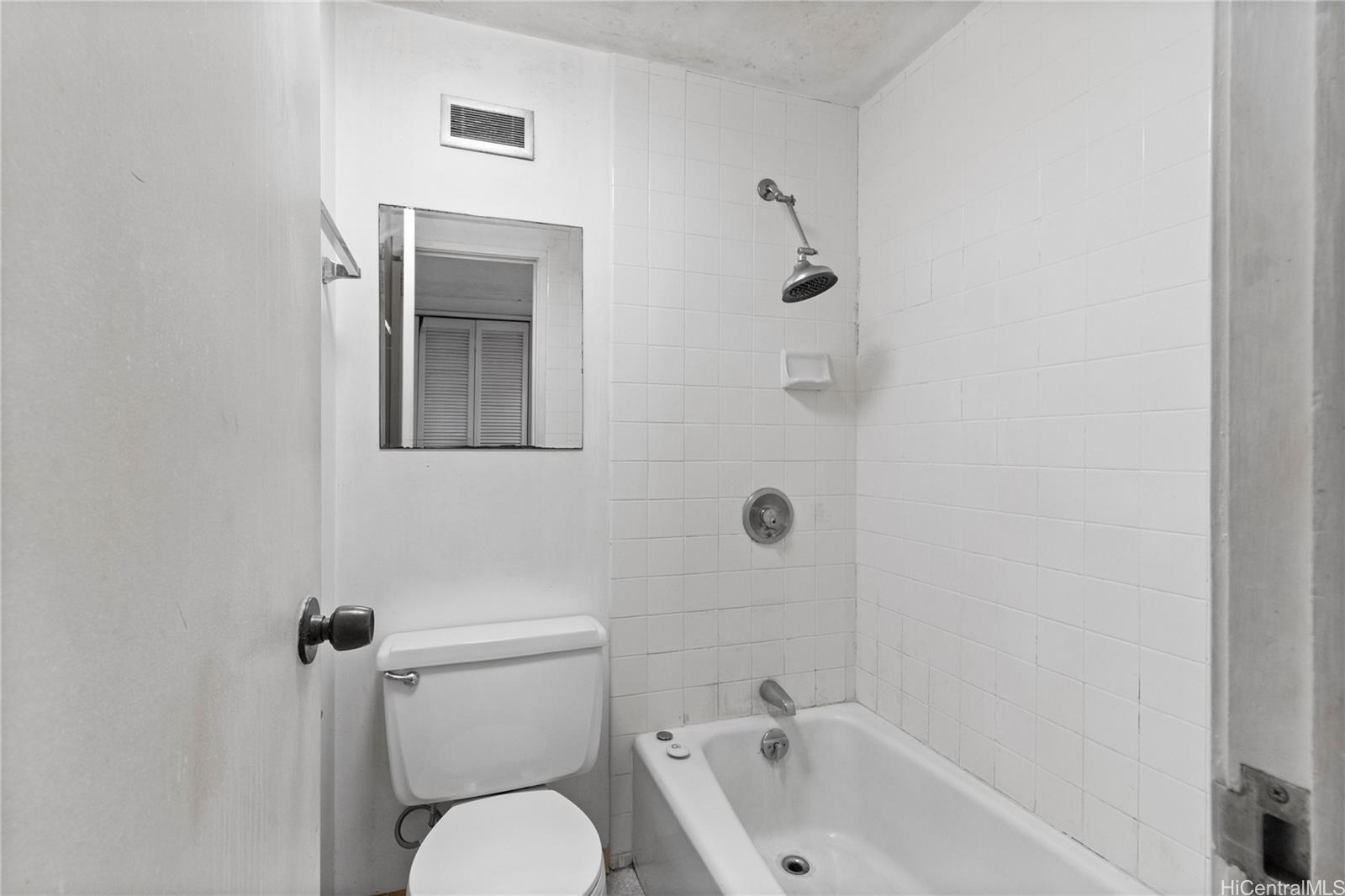 700 Richards Street, Unit 807 Honolulu, HI 96813 - Photo 9 of 15 a white toilet sitting next to a bath tub