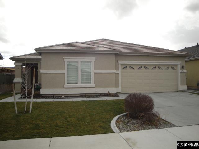 1730 Ornellaia Way Reno, NV 89521 - Photo 1 of 12 a front view of a house with garden