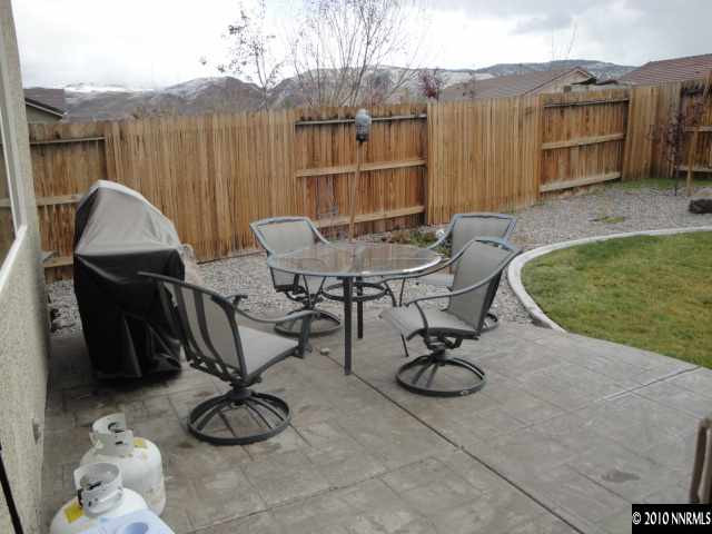 1730 Ornellaia Way Reno, NV 89521 - Photo 11 of 12 a view of a backyard with furniture and a tub