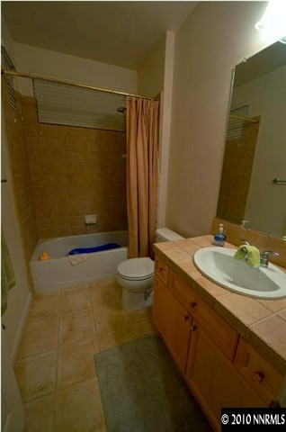 1730 Ornellaia Way Reno, NV 89521 - Photo 7 of 12 a bathroom with a sink a toilet and shower