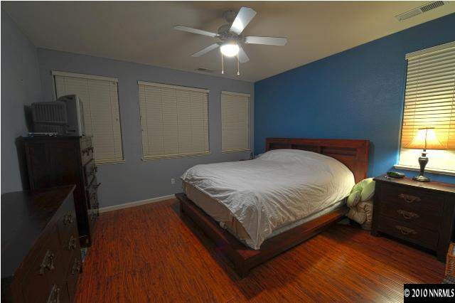 1730 Ornellaia Way Reno, NV 89521 - Photo 8 of 12 a bedroom with a bed and dresser