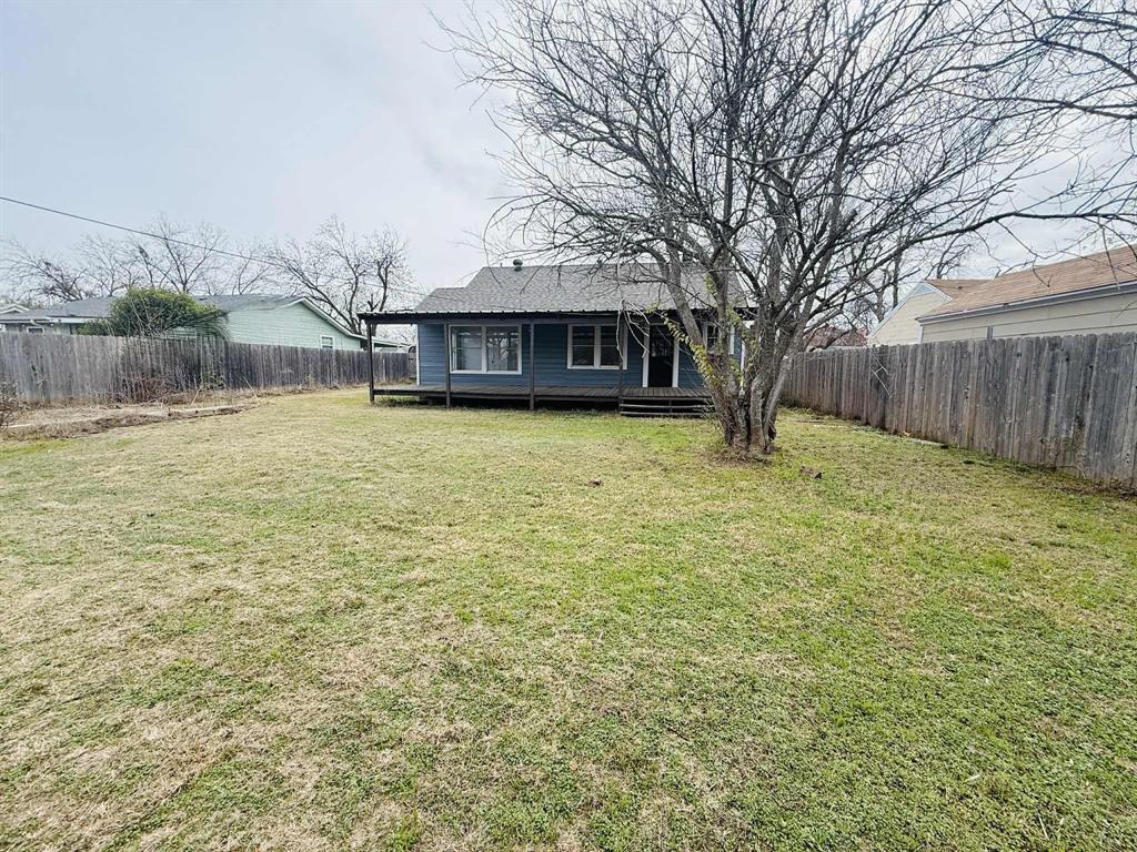 209 Hollywood Street Coleman, TX 76834 - Photo 5 of 19 a house with yard in front of it