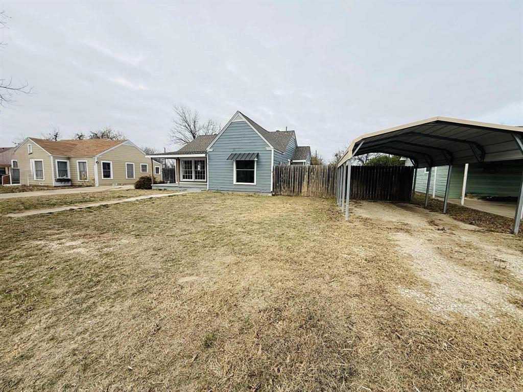 209 Hollywood Street Coleman, TX 76834 - Photo 6 of 19 a front view of a house with a yard