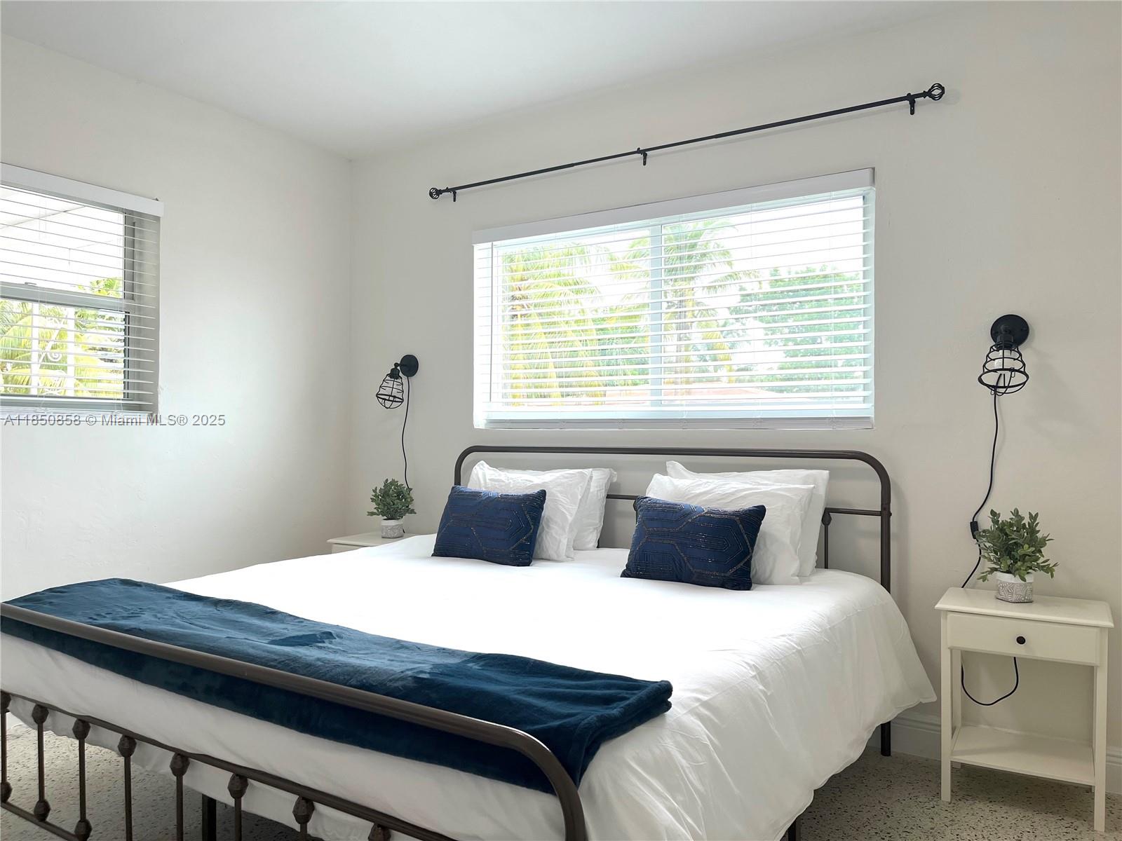 Westside Miami, FL 33167 - Photo 12 of 19 a bedroom with a bed and window