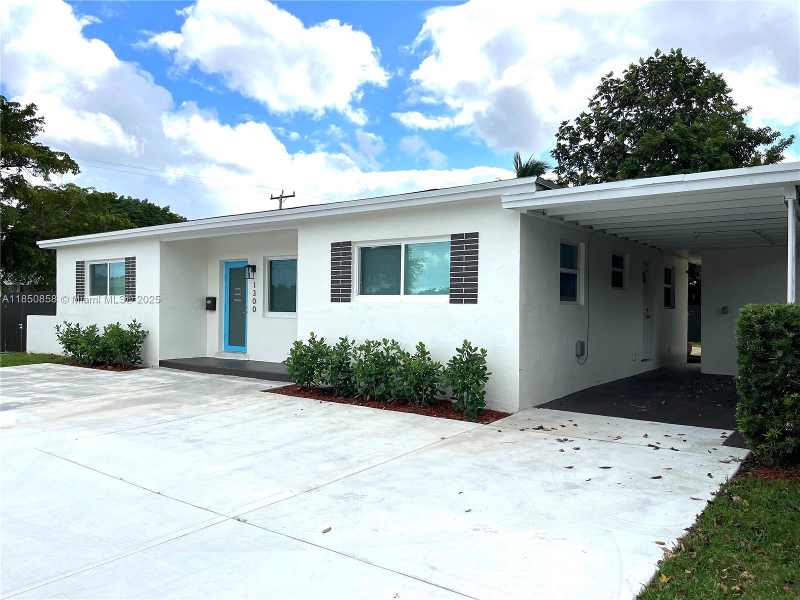 Westside Miami, FL 33167 - Photo 2 of 19 a front view of a house with a yard