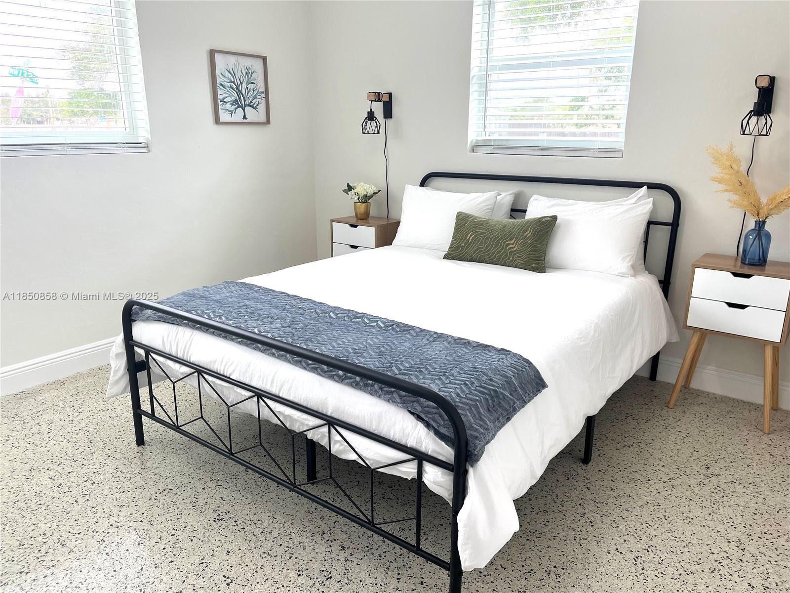 Westside Miami, FL 33167 - Photo 10 of 19 a bedroom with a bed and window