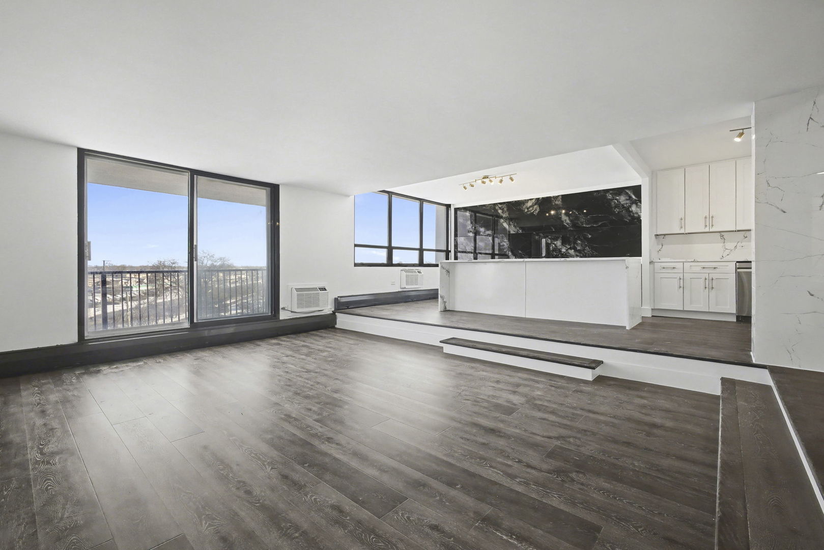 8801 West Golf Road, Unit 6E Niles, IL 60714 - Photo 3 of 15 a view of a kitchen with a sink and a large window