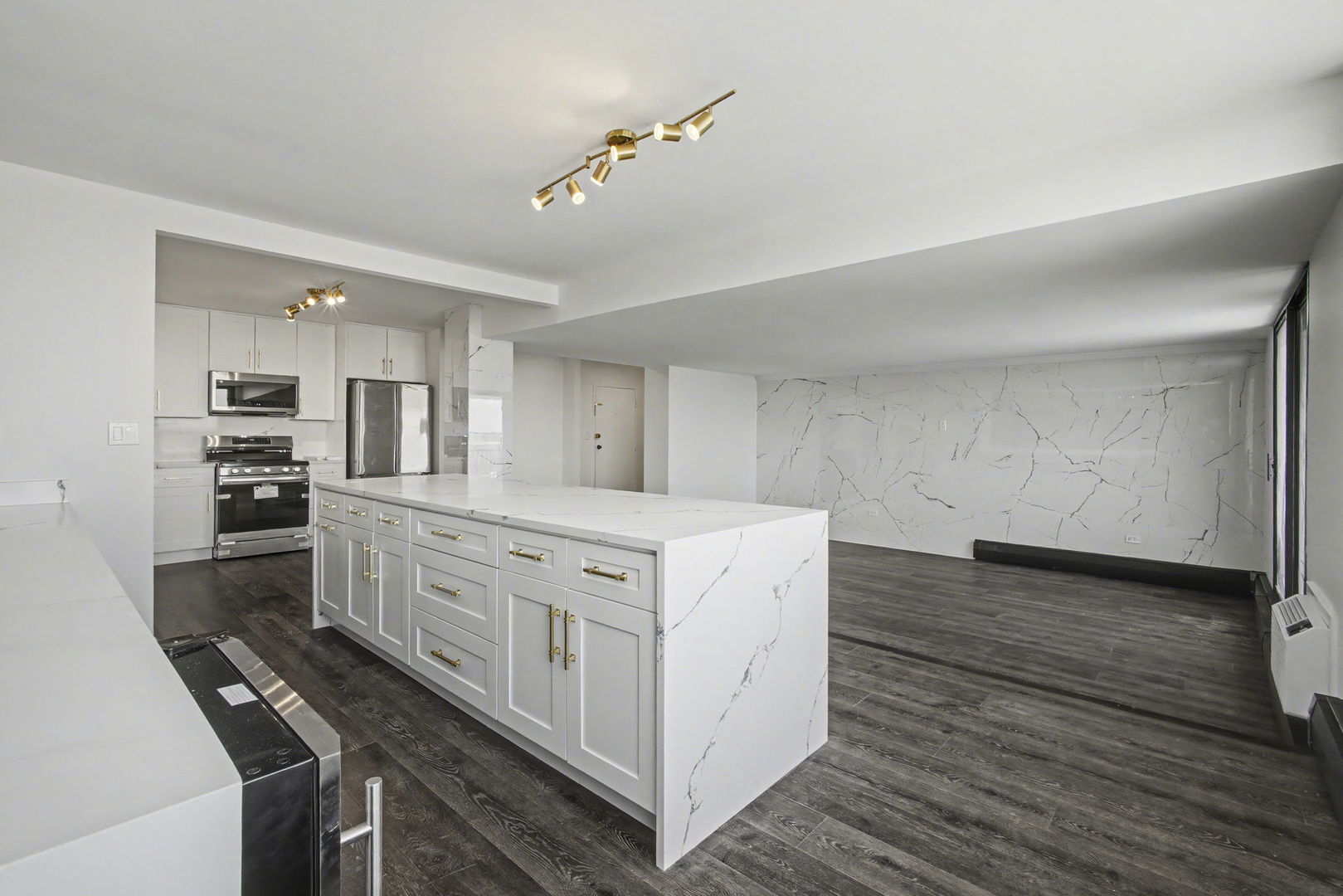 8801 West Golf Road, Unit 6E Niles, IL 60714 - Photo 6 of 15 a kitchen with stainless steel appliances a stove top oven a sink dishwasher and a refrigerator