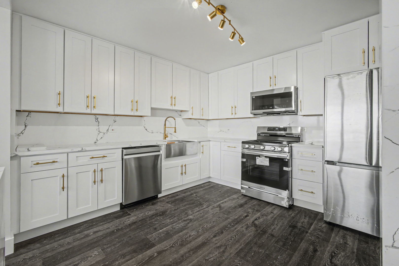 8801 West Golf Road, Unit 6E Niles, IL 60714 - Photo 7 of 15 a kitchen with granite countertop white cabinets and stainless steel appliances