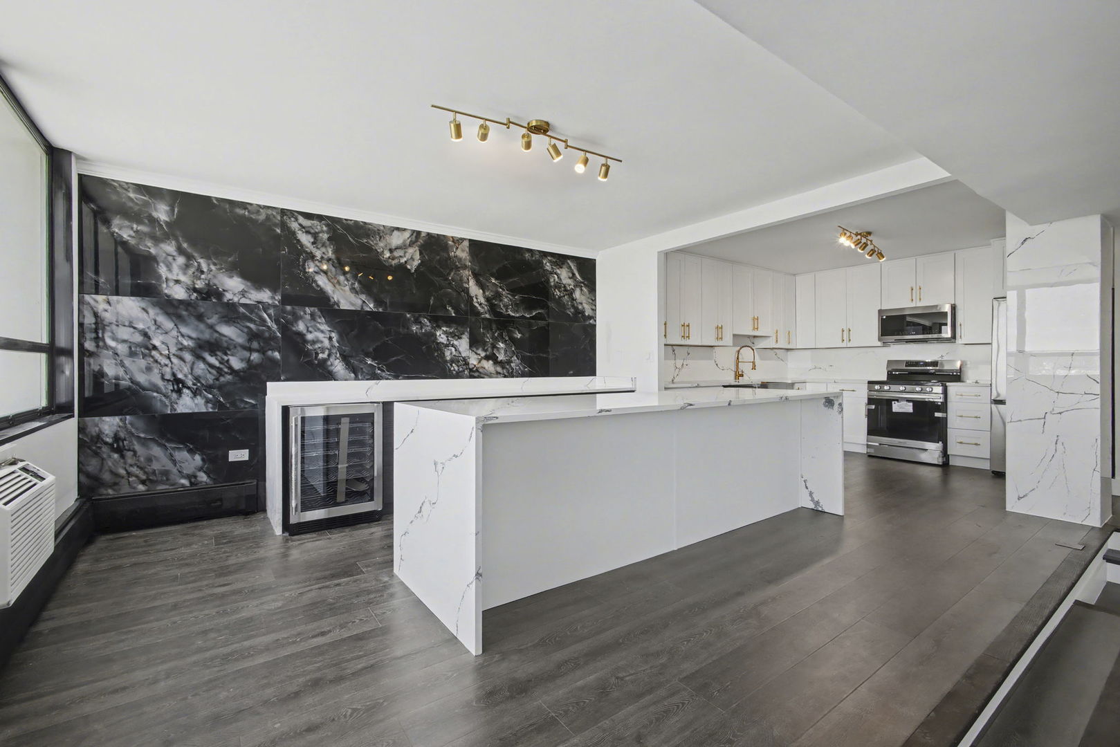 8801 West Golf Road, Unit 6E Niles, IL 60714 - Photo 10 of 15 a kitchen with stainless steel appliances wooden floor sink and wooden cabinets