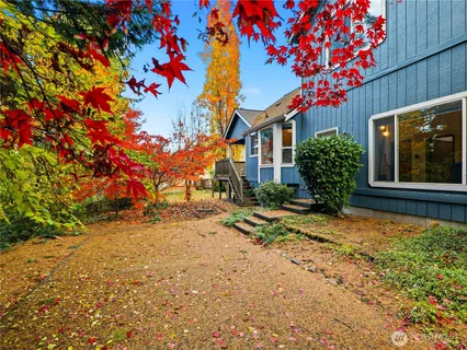 a view of a balcony with wooden floor