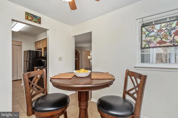 a view of a dining room with furniture and window
