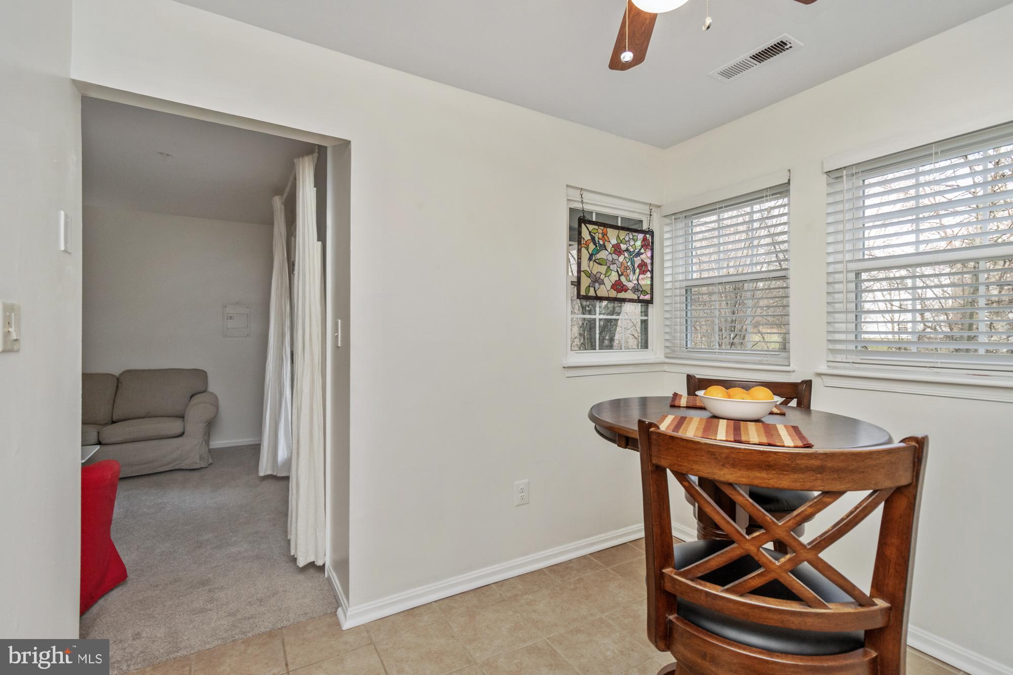 8489 Falls Run Road, Unit B Ellicott City, MD 21043 - Photo 15 of 41 a living room with furniture and a window