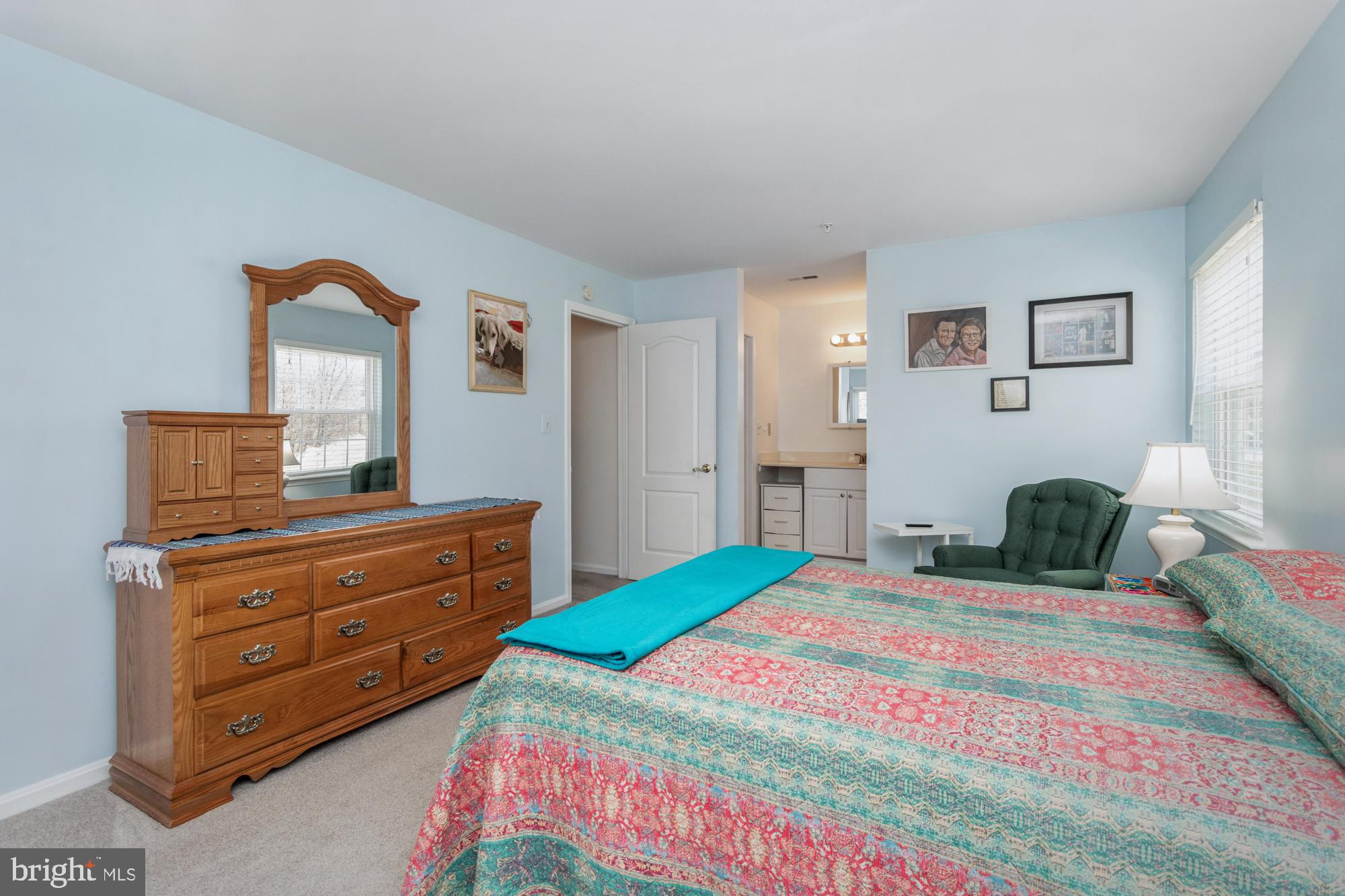 8489 Falls Run Road, Unit B Ellicott City, MD 21043 - Photo 24 of 41 a bedroom with a bed and a dresser