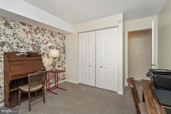 a view of a livingroom with furniture and staircase