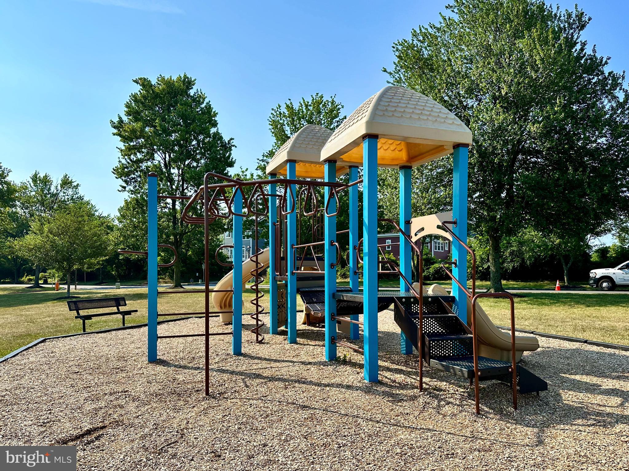 8489 Falls Run Road, Unit B Ellicott City, MD 21043 - Photo 39 of 41 a view of a park with swings and slides