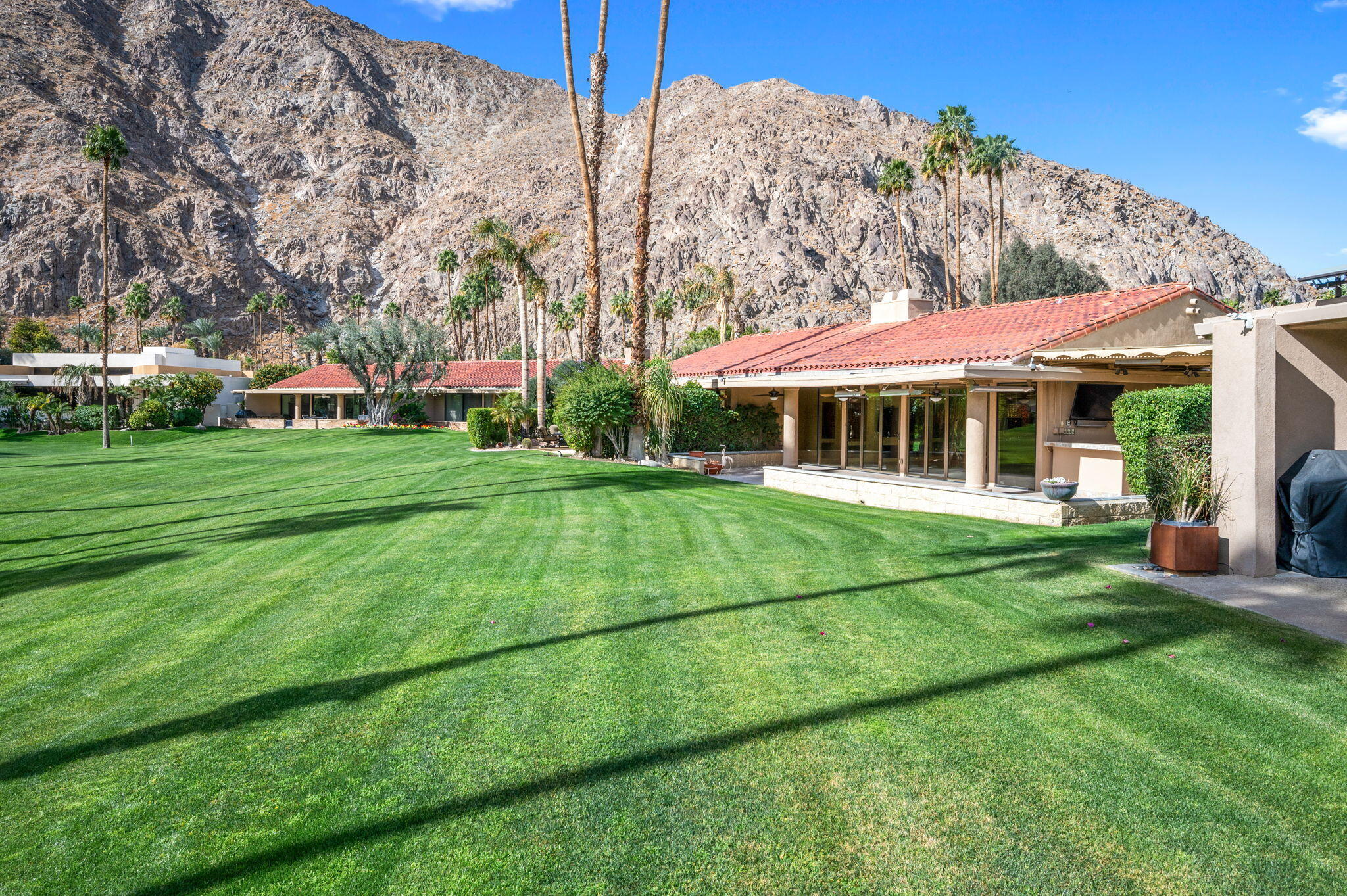 77675 Seminole Road Indian Wells, CA 92210 - Photo 2 of 40 a view of an house with backyard space and balcony