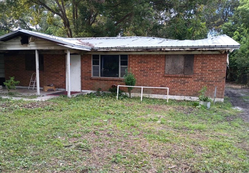 8321 Old Plank Road Jacksonville, FL 32220 - Photo 2 of 8 a front view of a house with garden